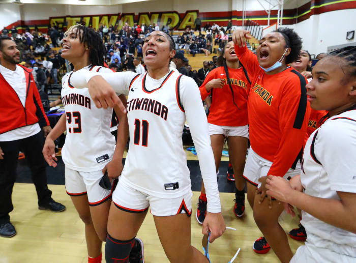 Kennedy Smith (11), celebrates another victory. Her team's current record in her career: 71-8. Photo: John Murphy